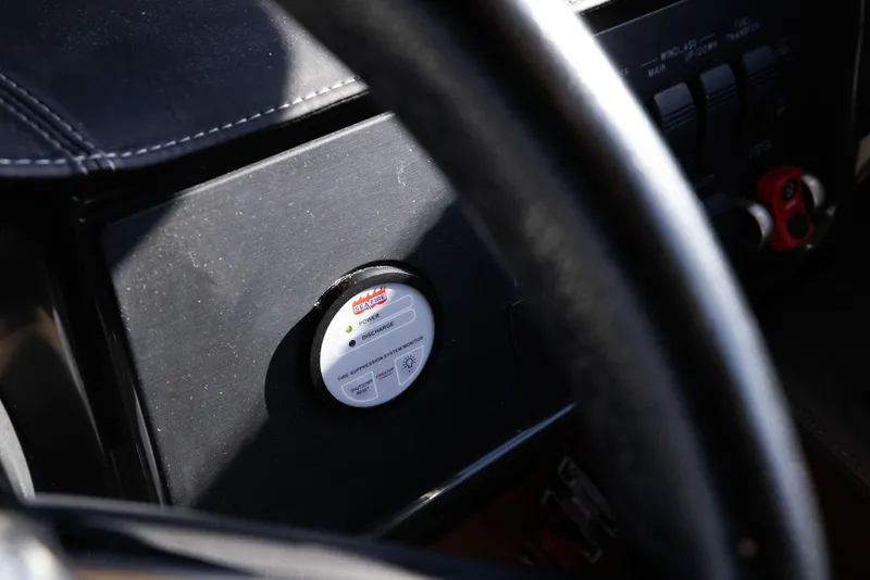 Slide: The Image of Close-up of 2017 Sea Ray 460 Sundancer dashboard with control panel. - 84