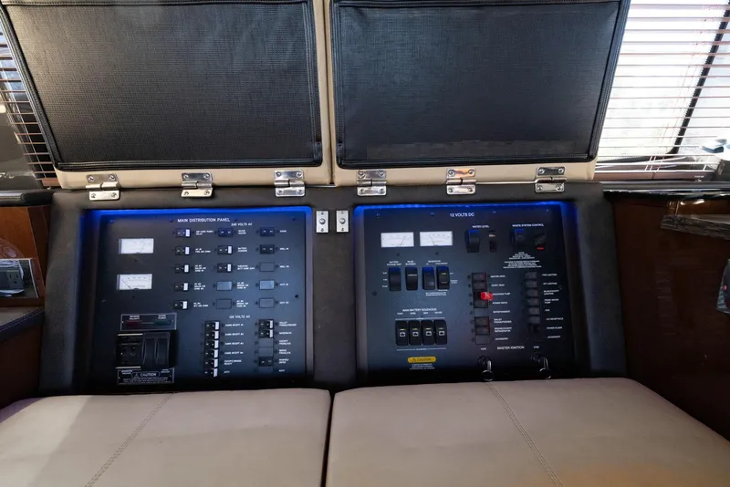 Slide: The Image of Control panel of 2017 Sea Ray 460 Sundancer yacht, featuring switches and indicators. - 88