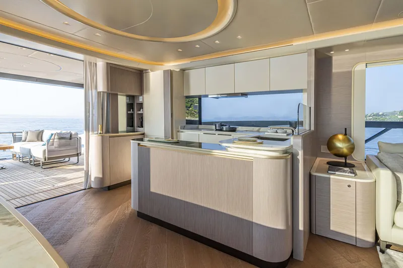 Slide: The Image of Luxurious interior of 2026 Absolute 70 N yacht with modern kitchen and ocean view. - 21