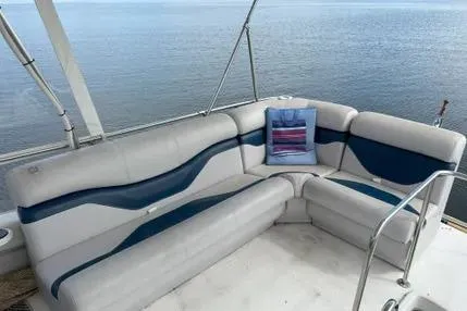 Slide: The Image of 1979 Mainship 34 Trawler with white and blue seating, ocean view in background. - 7