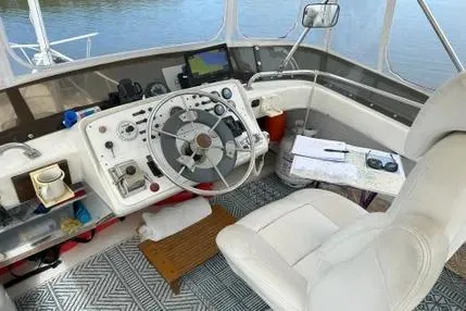 Slide: The Image of 1979 Mainship 34 Trawler helm with steering wheel, navigation equipment, and comfortable seating. - 8