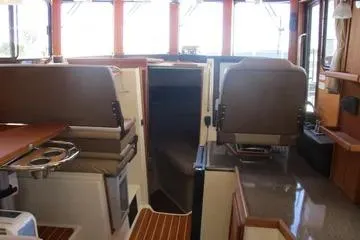 Slide: The Image of Interior of 2021 Ranger Tugs R-31 CB boat with seating and helm station. - 18