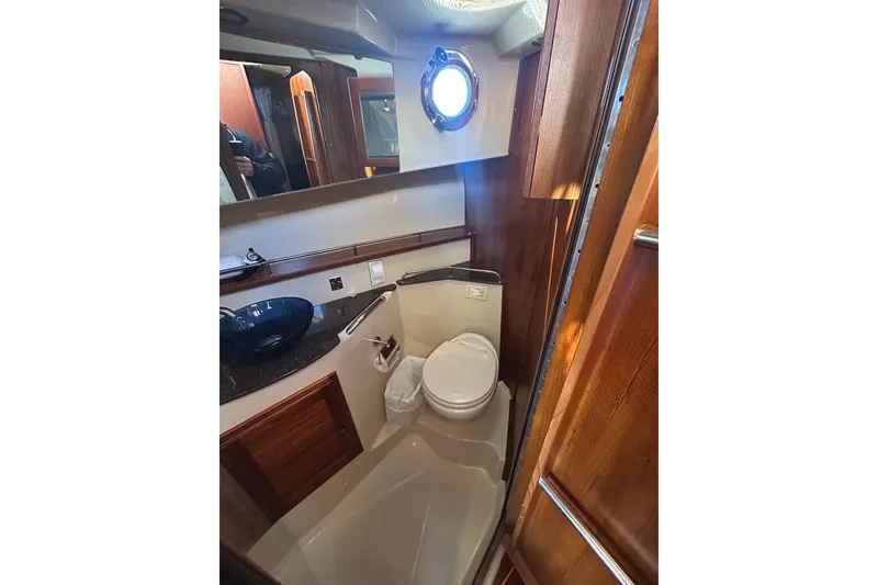 Slide: The Image of 2021 Ranger Tugs R-31 CB bathroom with modern fixtures and wooden accents. - 20