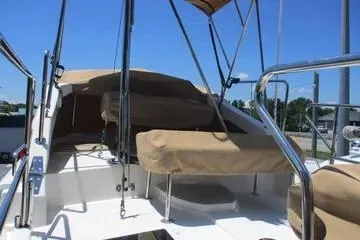 Slide: The Image of 2021 Ranger Tugs R-31 CB boat deck with tan covers and stainless steel railings. - 22