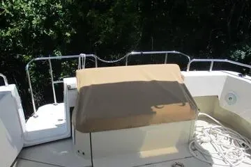 Slide: The Image of 2021 Ranger Tugs R-31 CB boat deck with railing and covered seating area. - 5