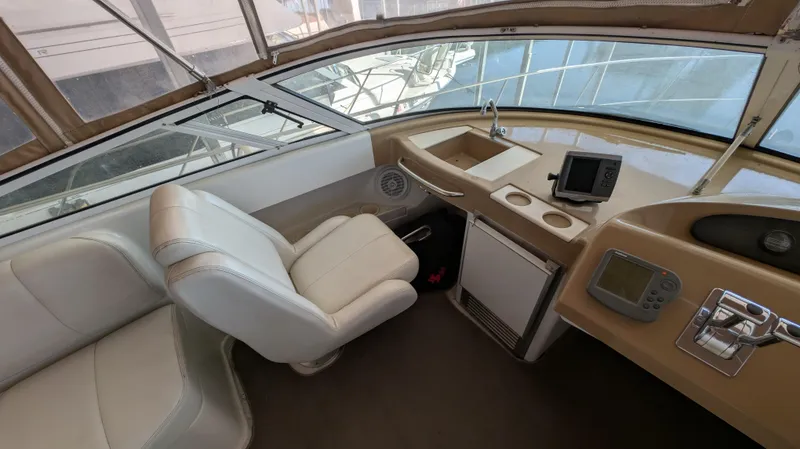 Slide: The Image of Interior of 2002 Carver 350 Mariner with helm and seating. - 13