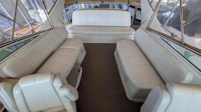 Slide: The Image of Interior of 2002 Carver 350 Mariner with white leather seating. - 14