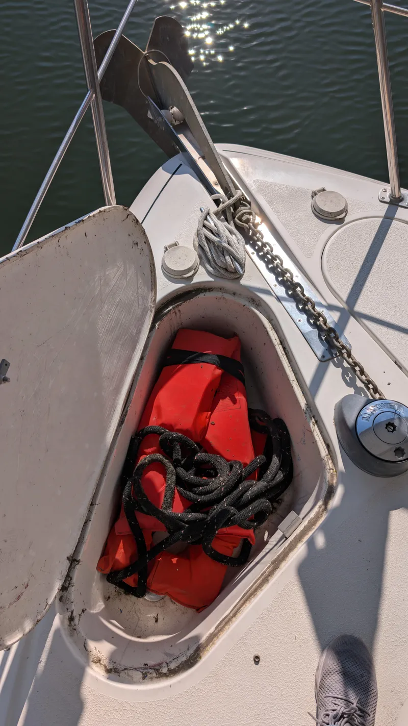 Slide: The Image of Life jacket in storage compartment of a 2002 Carver 350 Mariner boat. - 19