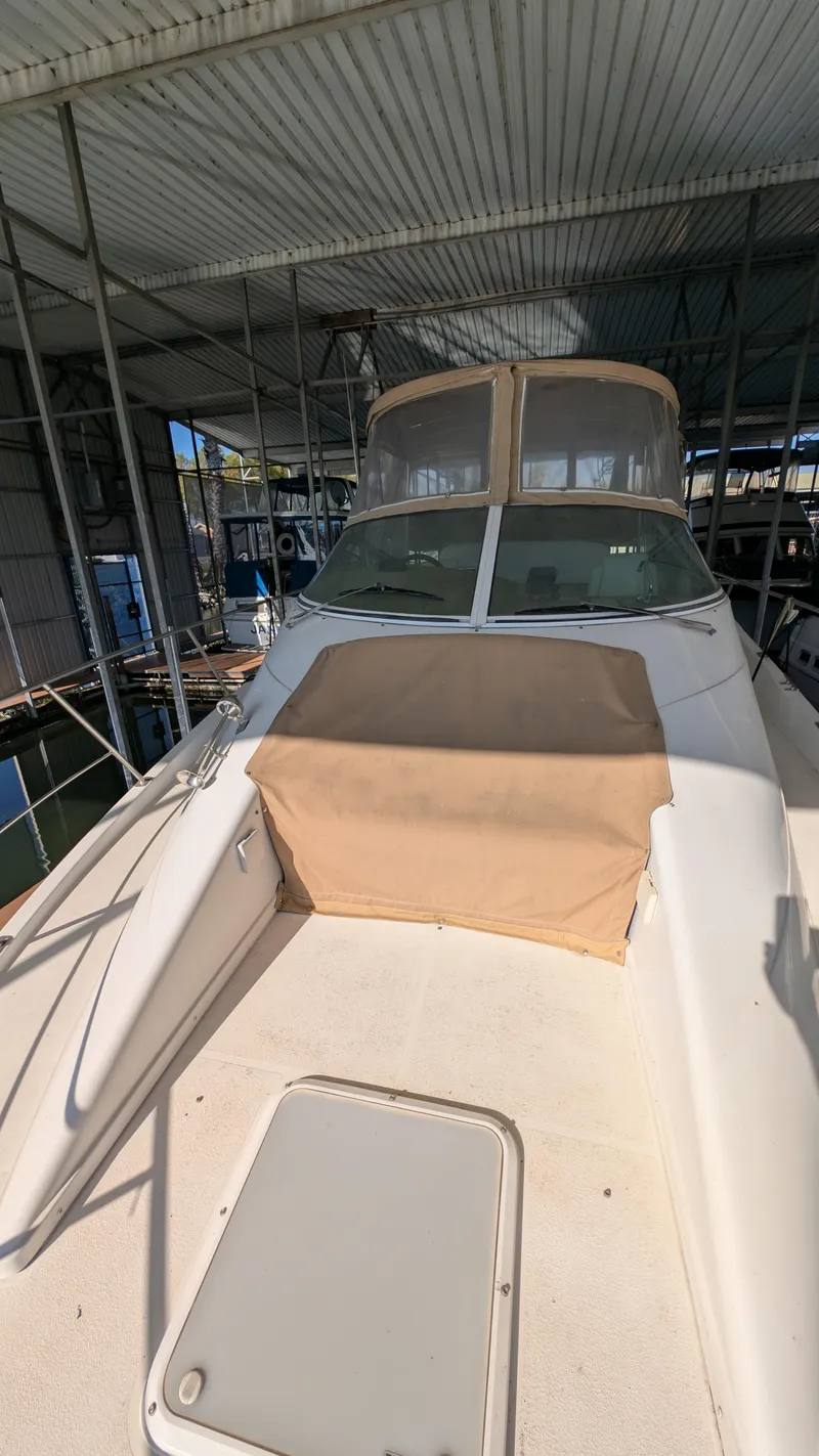 Slide: The Image of 2002 Carver 350 Mariner yacht in covered dock. - 20