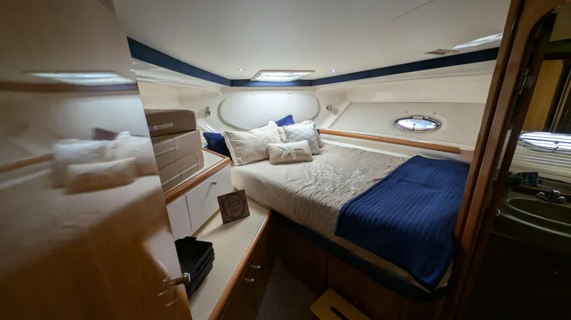 Slide: The Image of Interior of 2002 Carver 350 Mariner with cozy bedroom. - 32