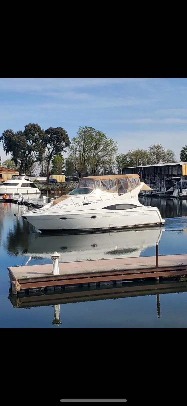The Image of 2002 Carver 350 Mariner yacht docked, calm waters. - 0