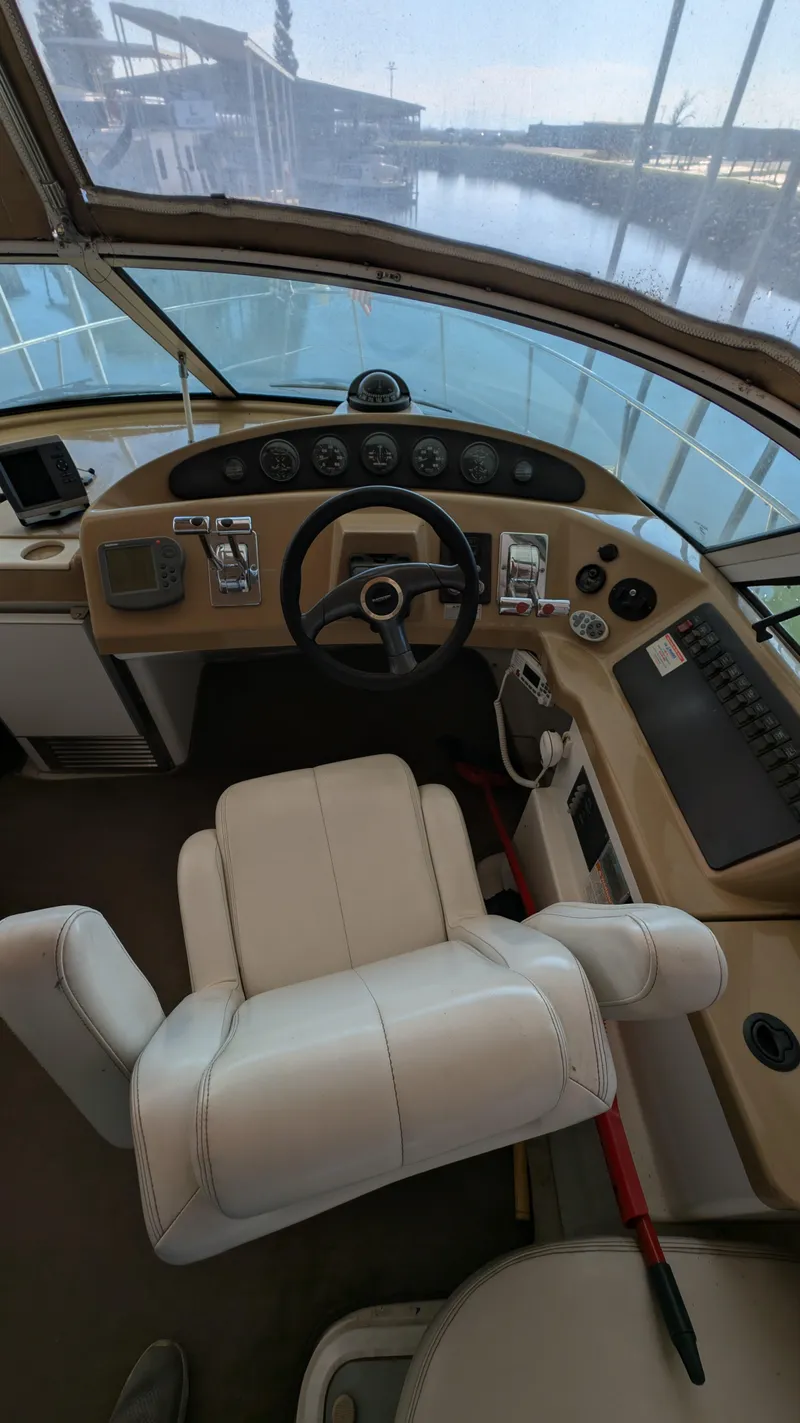 Slide: The Image of Interior view of a 2002 Carver 350 Mariner boat cockpit. - 12