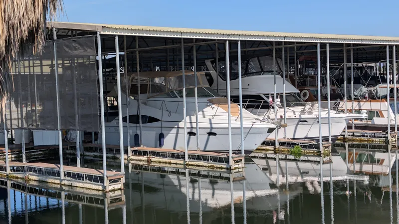 Slide: The Image of 2002 Carver 350 Mariner docked in covered marina. - 3