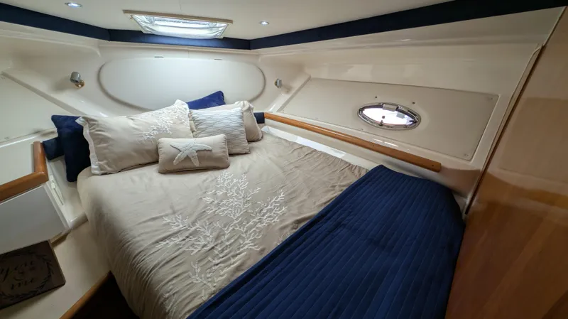 Slide: The Image of Interior of 2002 Carver 350 Mariner with cozy bed. - 34