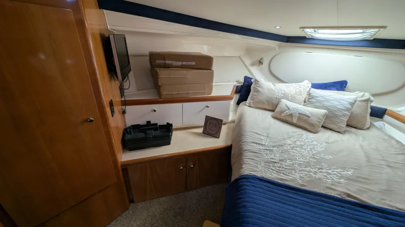 Slide: The Image of Interior of 2002 Carver 350 Mariner with bed and storage. - 35