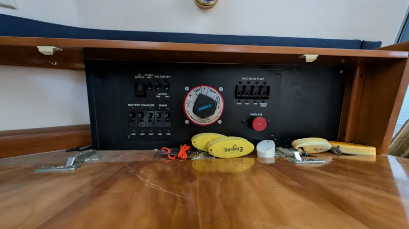 Slide: The Image of Control panel of 2002 Carver 350 Mariner with switches and gauges. - 38