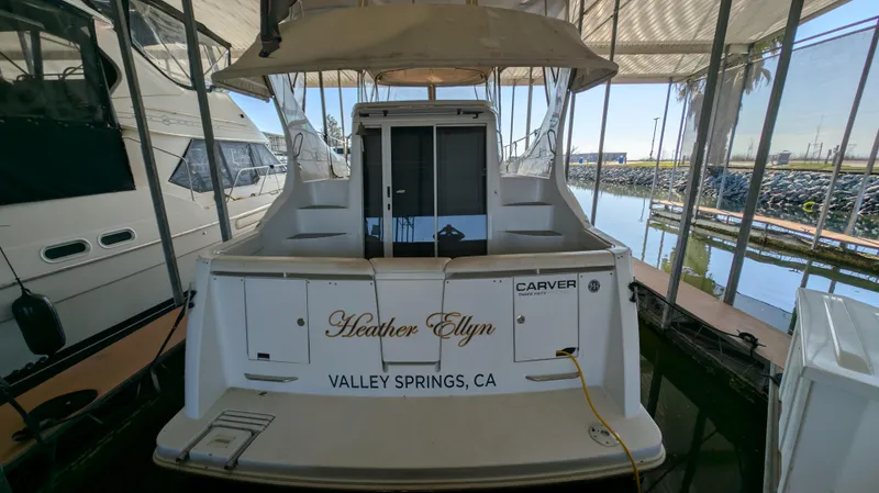 Slide: The Image of Rear view of Carver 350 Mariner yacht docked. - 5