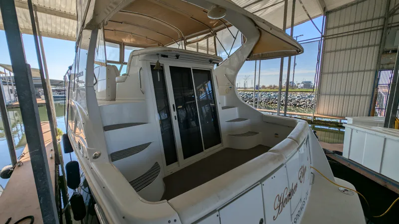 Slide: The Image of 2002 Carver 350 Mariner docked in a covered marina. - 7