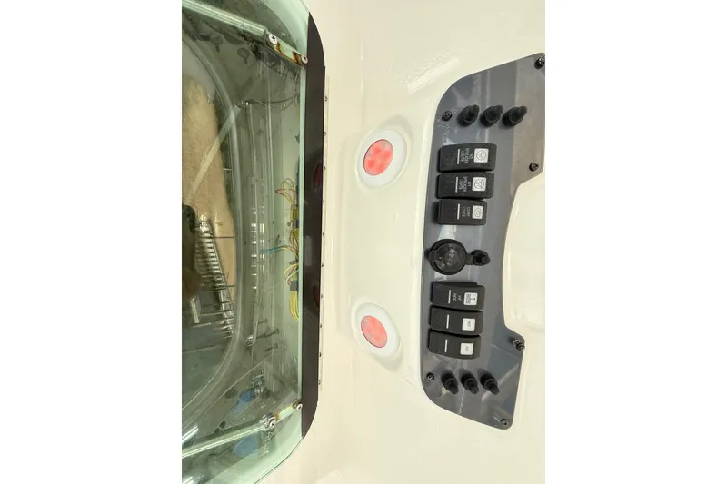 Slide: The Image of 2008 Robalo R240 Center Console dashboard with control switches and wiring. - 15
