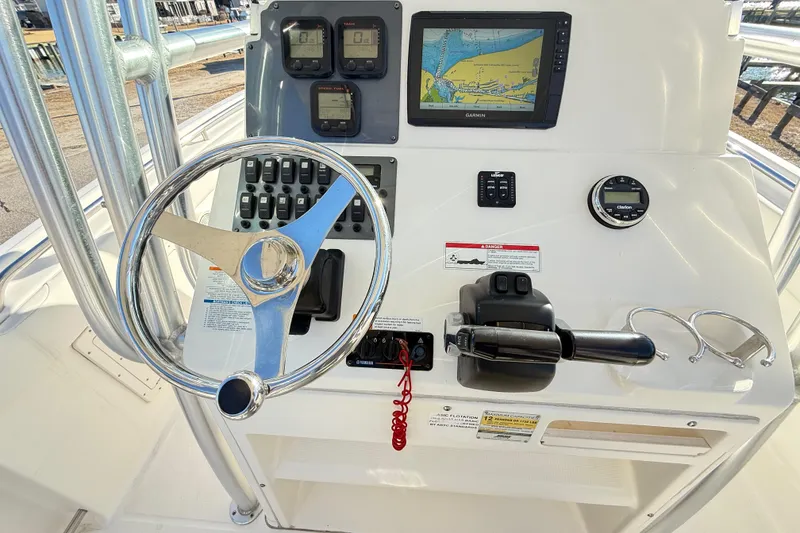 Slide: The Image of 2008 Robalo R240 Center Console dashboard with steering wheel, controls, and navigation display. - 18