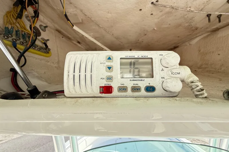 Slide: The Image of VHF marine radio on 2008 Robalo R240 Center Console boat dashboard. - 19