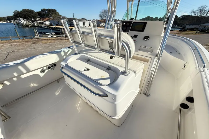 Slide: The Image of 2008 Robalo R240 Center Console boat interior with seating and console, dockside view. - 20
