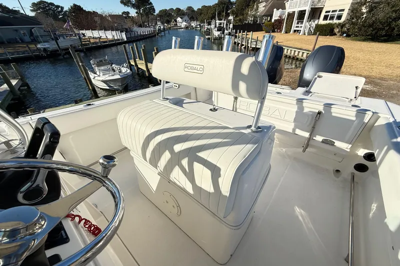 Slide: The Image of 2008 Robalo R240 Center Console boat interior with steering wheel and seating. - 21