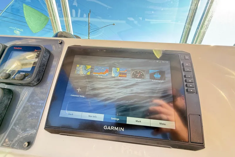 Slide: The Image of Garmin navigation display on 2008 Robalo R240 Center Console boat dashboard. - 28