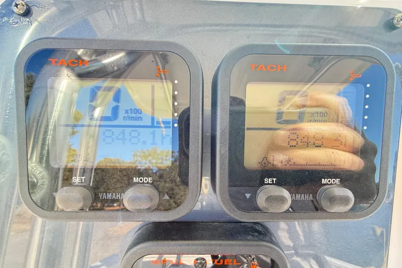 Slide: The Image of 2008 Robalo R240 Center Console tachometer display showing engine RPM and hours. - 29