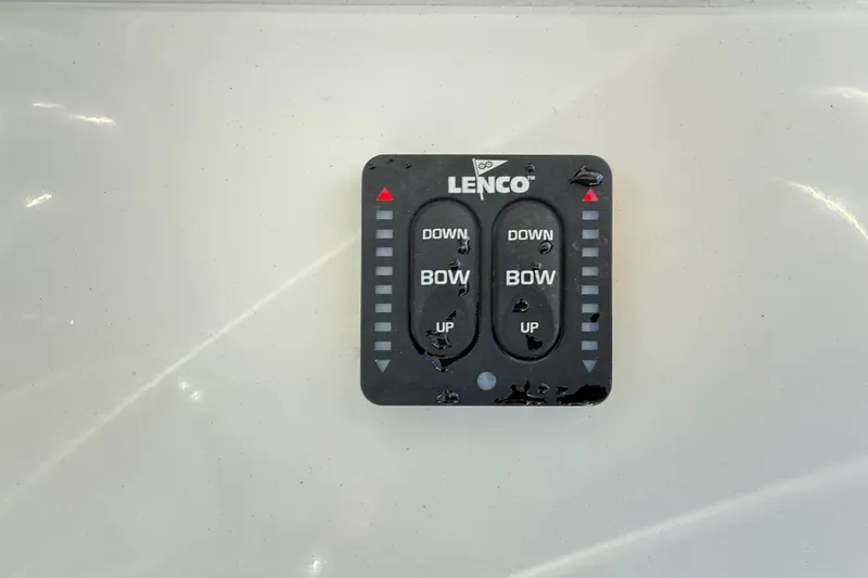 Slide: The Image of Control panel of a 2008 Robalo R240 Center Console boat with Lenco trim tab switches. - 30