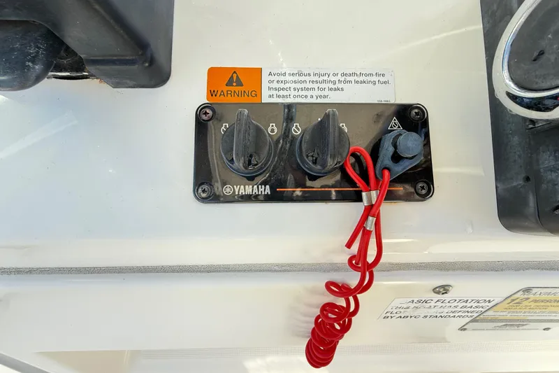 Slide: The Image of Yamaha ignition panel with warning label on 2008 Robalo R240 Center Console boat. - 32