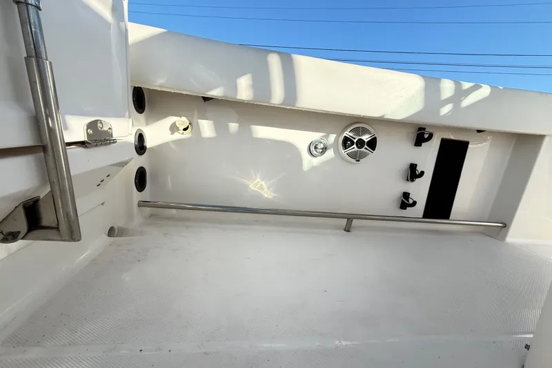 Slide: The Image of 2008 Robalo R240 Center Console boat interior with stainless steel rail and speaker. - 37