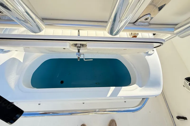 Slide: The Image of Livewell on 2008 Robalo R240 Center Console boat, open lid, stainless steel fittings. - 40