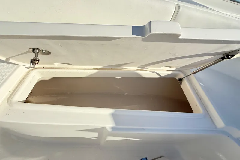 Slide: The Image of Open storage compartment on 2008 Robalo R240 Center Console boat. - 45