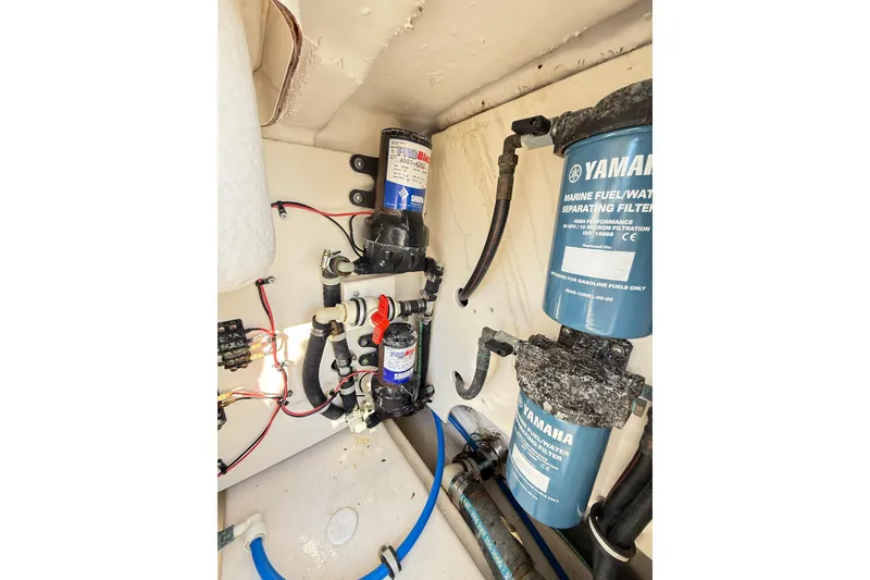 Slide: The Image of 2008 Robalo R240 Center Console boat engine compartment with Yamaha fuel filters. - 51