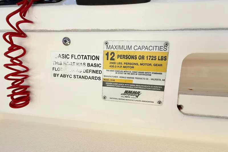 Slide: The Image of 2008 Robalo R240 Center Console capacity label, 12 persons or 1725 lbs, basic flotation. - 56
