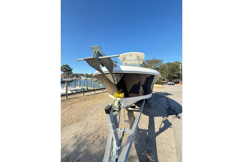 Slide: The Image of 2008 Robalo R240 Center Console boat on trailer, parked near waterfront. - 6