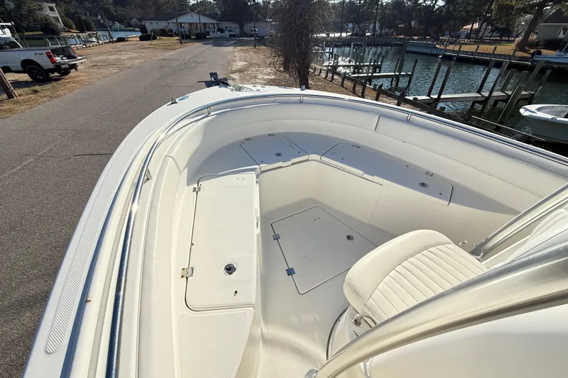Slide: The Image of 2008 Robalo R240 Center Console boat interior with seating and storage compartments. - 9