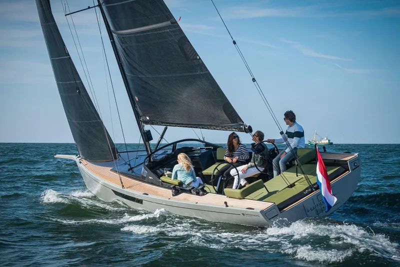 The Image of 2026 Saffier SE 33 Life sailboat with vibrant green sail on open water. - 0