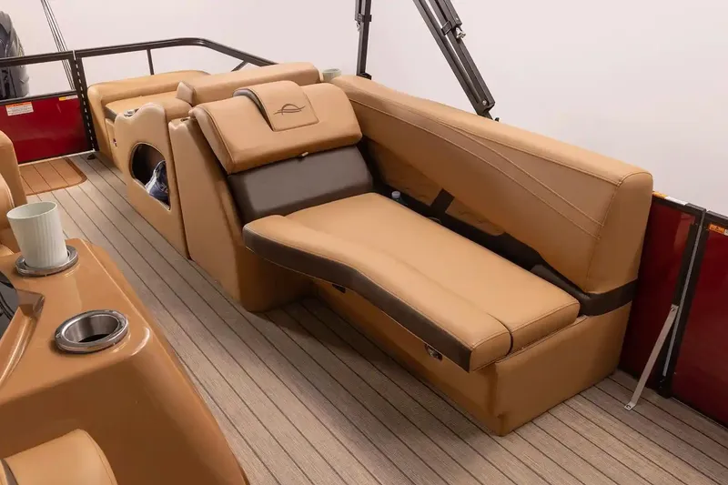 Slide: The Image of 2026 SunCatcher Fusion 324SS boat interior with tan seating and cup holders. - 10