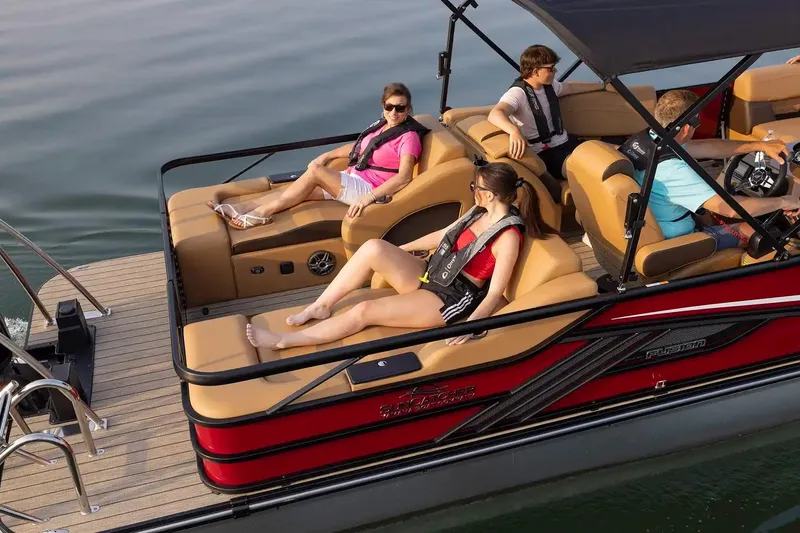 Slide: The Image of People relaxing on a 2026 SunCatcher Fusion 324SS boat on the water. - 15