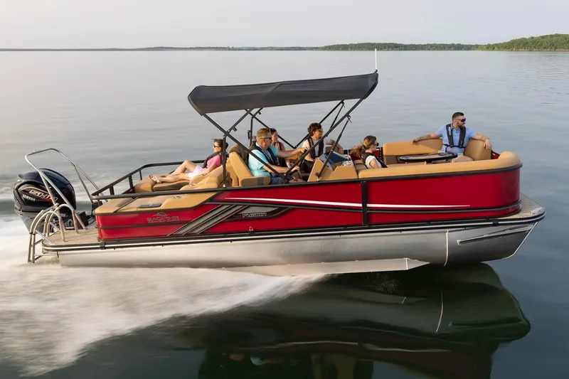 Slide: The Image of 2026 SunCatcher Fusion 324SS pontoon boat cruising on a serene lake. - 16