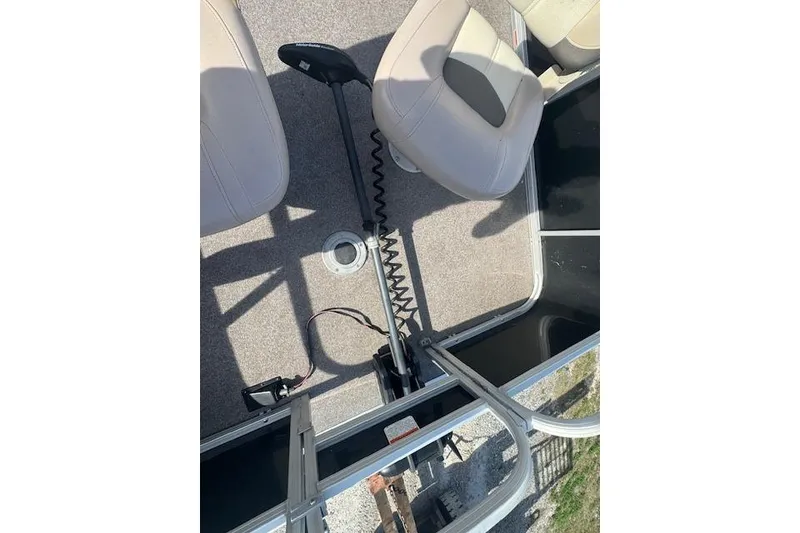 Slide: The Image of 2015 Sun Tracker Bass Buggy 16 DLX interior with seats and trolling motor. - 11