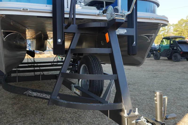Slide: The Image of Trailer hitch and ladder of 2026 SunCatcher Select 20F boat on dry land. - 13
