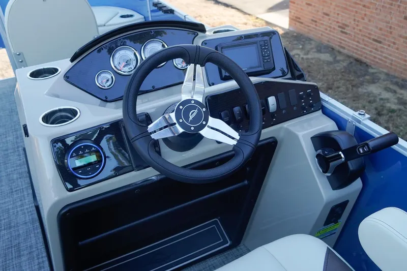 Slide: The Image of 2026 SunCatcher Select 20F boat dashboard with steering wheel and control panel. - 15