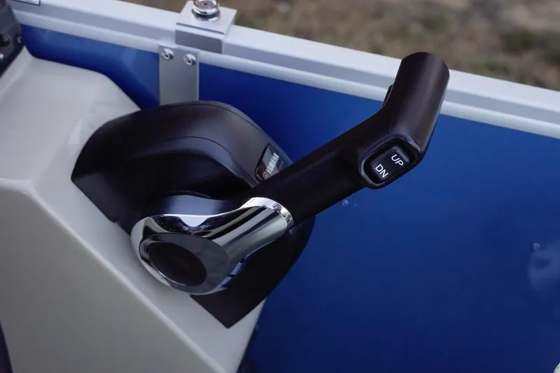 Slide: The Image of Throttle control lever on 2026 SunCatcher Select 20F boat, featuring up and down buttons. - 19