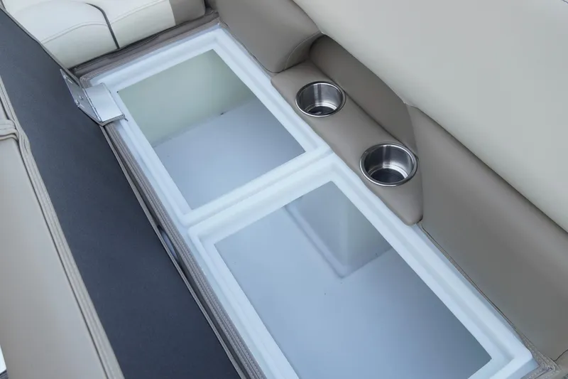 Slide: The Image of Interior of 2026 SunCatcher Select 20F boat with storage compartments and cup holders. - 24