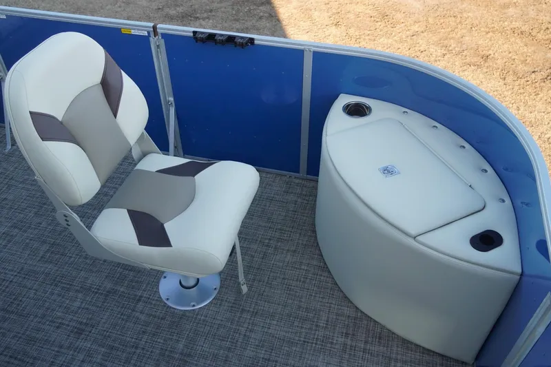 Slide: The Image of SunCatcher Select 20F 2026 boat interior with cushioned seat and storage compartment. - 26