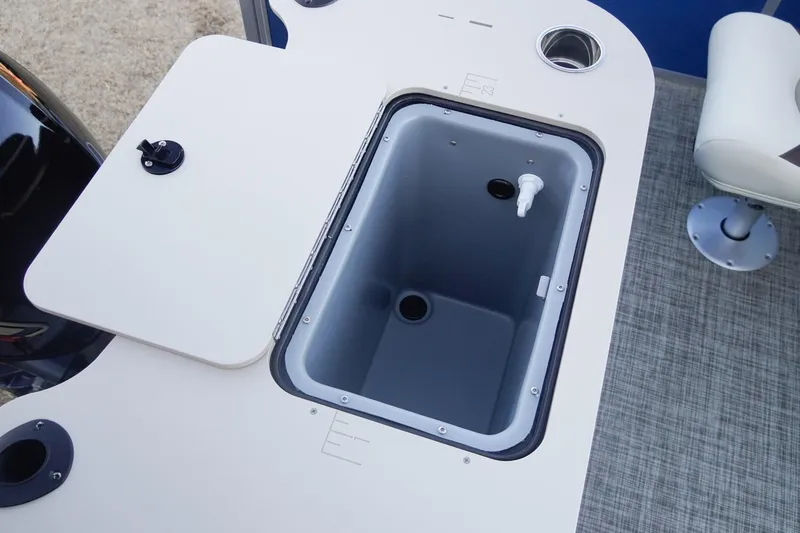 Slide: The Image of 2026 SunCatcher Select 20F boat interior with open storage compartment and seating. - 32