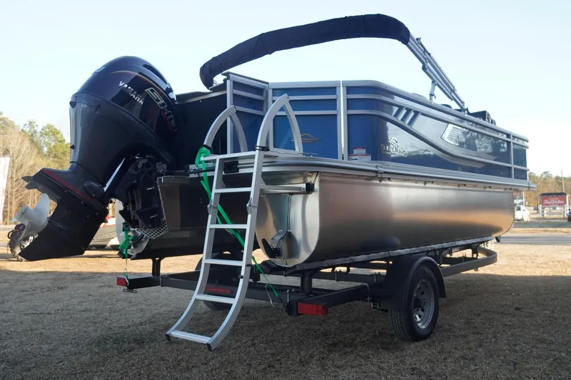 Slide: The Image of 2026 SunCatcher Select 20F pontoon boat on trailer, featuring Yamaha outboard motor. - 9